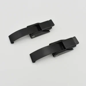 Two black, spring-loaded 113-0 metal clips are positioned side by side on a light gray background.