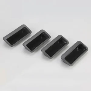 Four black rectangular rubber feet from product 143-0 are aligned horizontally on a plain gray background.