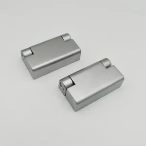 Two 23-0 silver rectangular door hinges lie on a plain white surface. Both hinges are closed and placed parallel to each other.