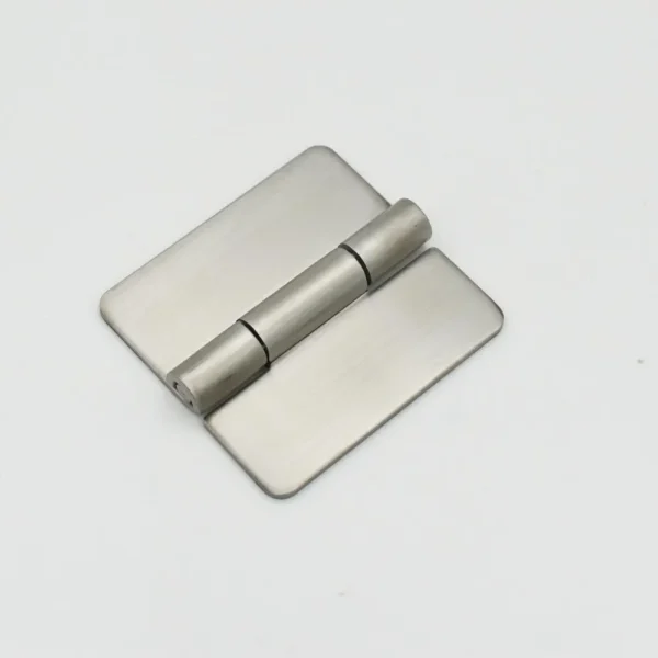 Close-up of a 79-0 rectangular metal hinge with a cylindrical pin in the middle, laying flat on a white surface.