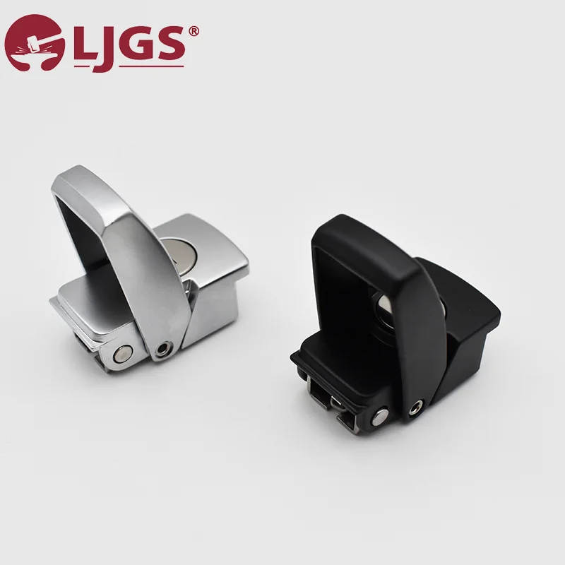 On a white background lie two sleek toggle latches: the DK604-1 in silver stainless steel and another in black.