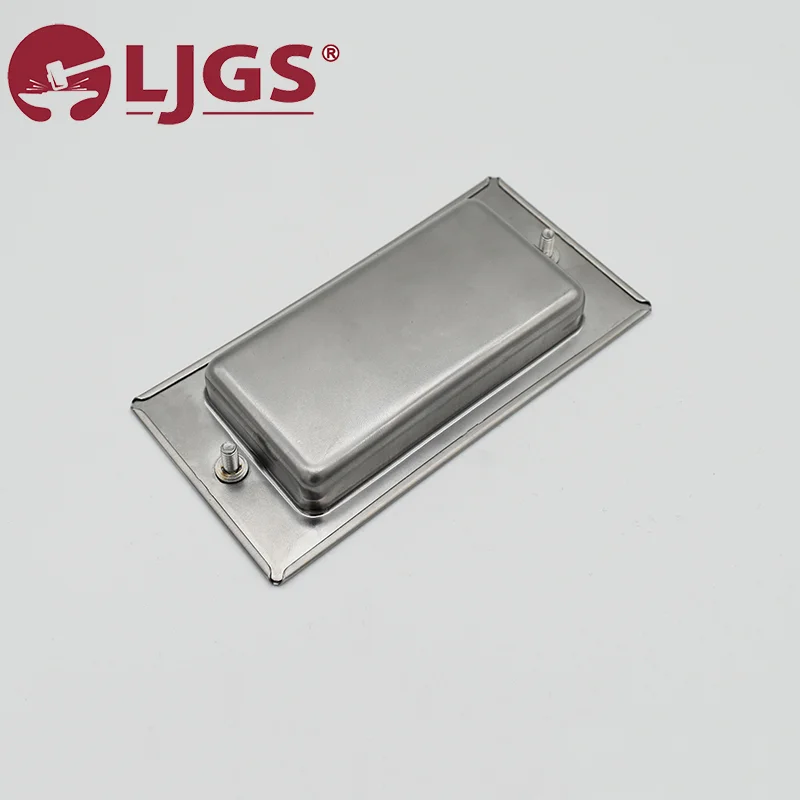 The LS-ES-1321 (2) is a rectangular stainless steel cover resting on a metal base, adorned with the L JGS logo in the top left corner and secured by two screws. It is designed with sleek handles to ensure easy maneuverability.