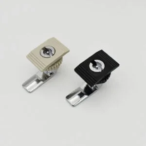 Two MS7010 locks, featuring rectangular knobs in beige and black finishes, rest elegantly on a pristine white surface.