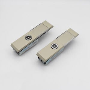 Model MS821 (1) consists of two beige metal clips with silver fasteners, elegantly positioned on a pristine white background.