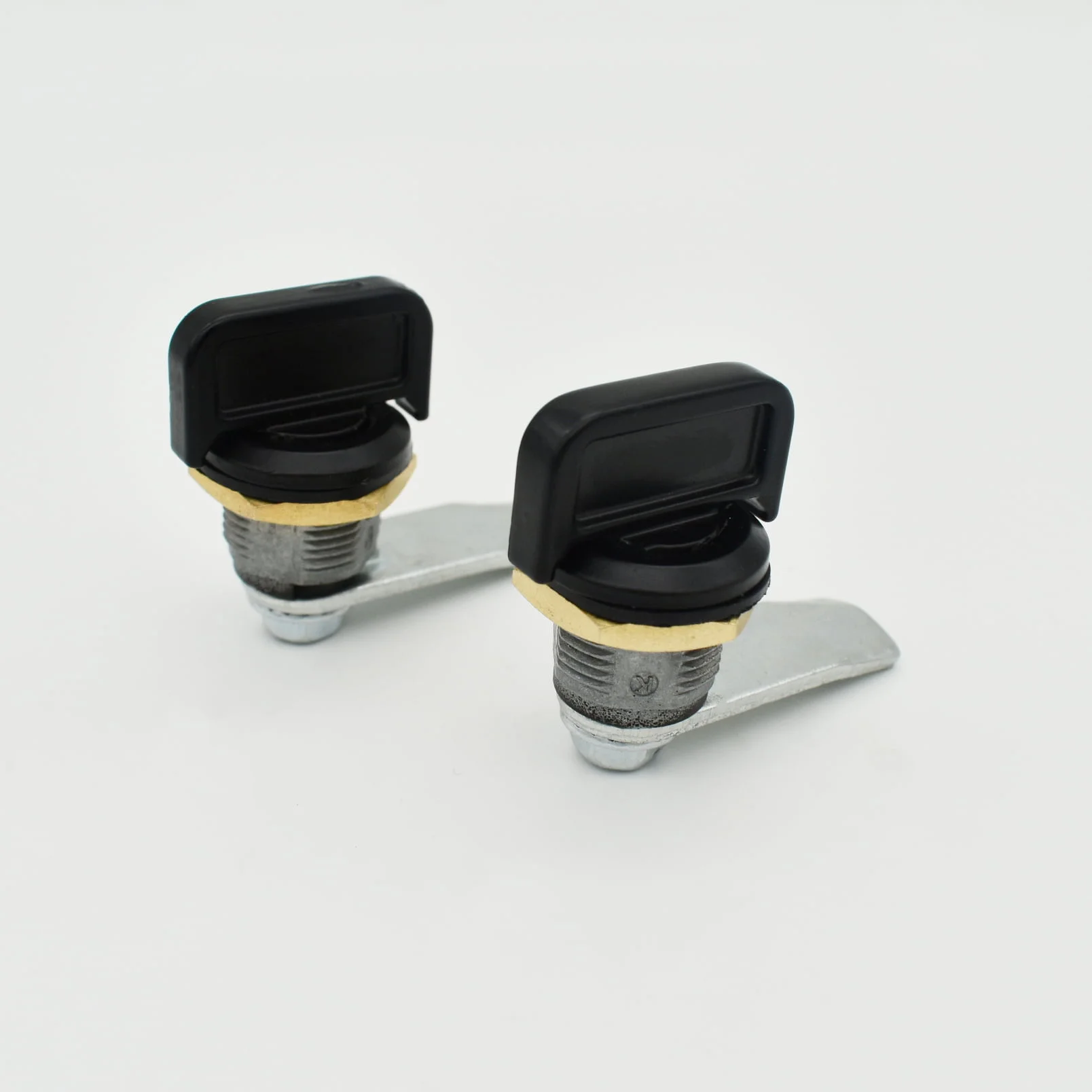 A pair of MS845-3 metal cam lock fittings with black keys are lying on a white background.