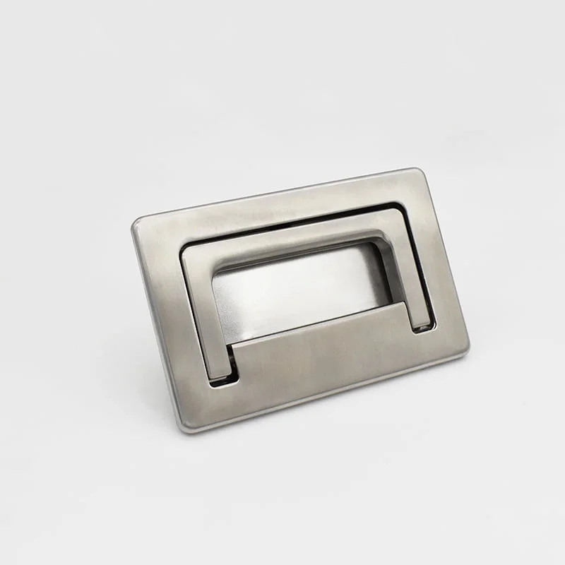 Rectangular e7922f7f88e181d307fe3c7fddc7dcc metal flush pull handle boasting a sleek, modern design against a plain background.
