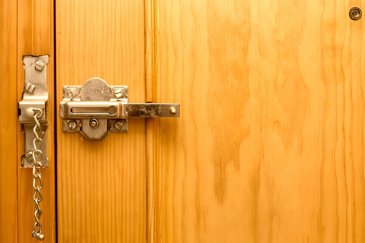 A sliding door lock from the application scenario diagram features a wooden design complemented by a metal chain lock and a latch lock, evoking classic security reminiscent of those found in traditional sliding closet locks.